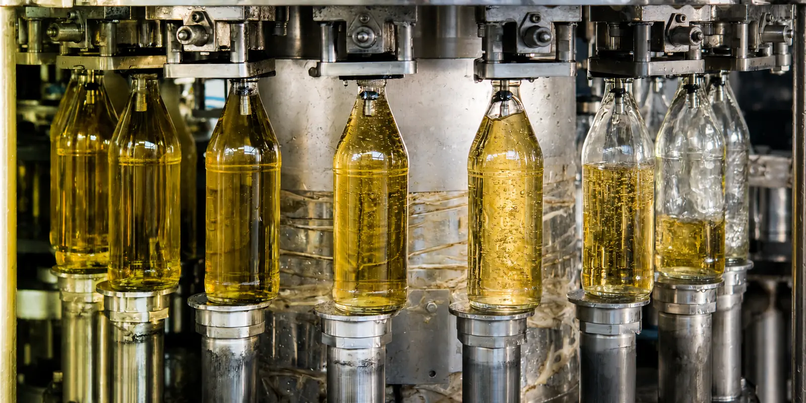 Wine bottles being filled on a filling line